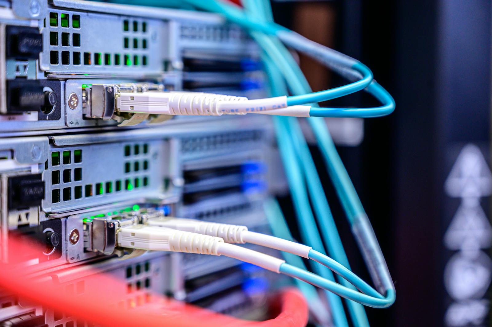 Server room with fiber-optic cables routing internet traffic